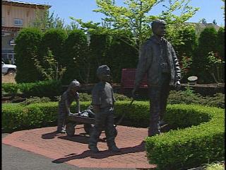 In DuPont, Wa, bronze depiction of family coming home.